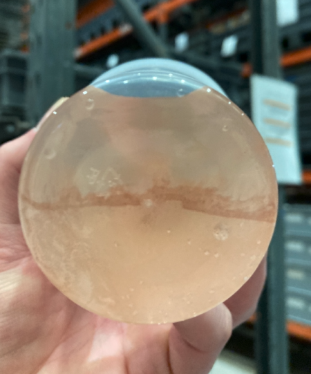 Melted ice shows the contamination removed in the first round of Ice Pigging.